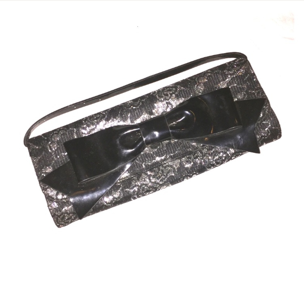Metallic silver clutch with black lace overlay